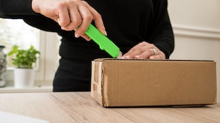 Woman Opens a Package