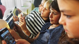 Children With Smartphones in Hand