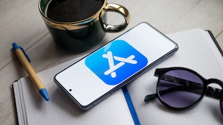 Smartphone on notebook with Apple App Store logo