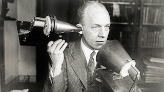 Man Talks on a Telephone Device Developed by Alexander Graham Bell