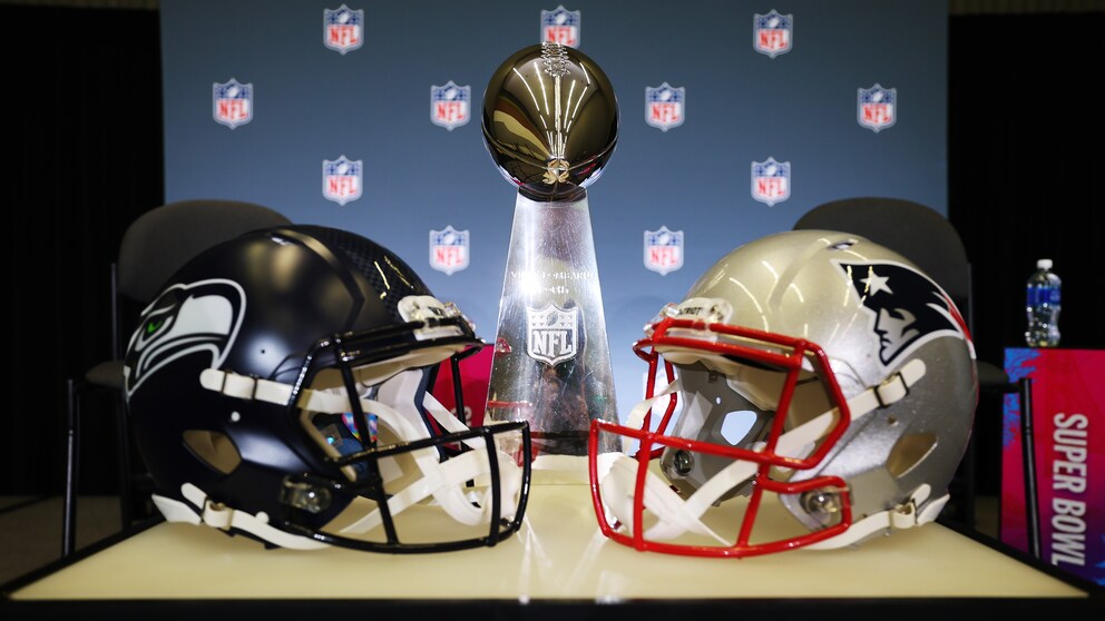 Two football helmets from the opposing teams.