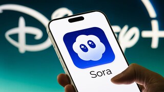 Smartphone with Sora logo and Disney logo in the background