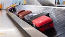 Luggage rack with suitcases
