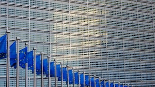 Flags of the European Union in front of the European Commission building