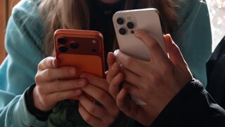 Two Children With iPhones