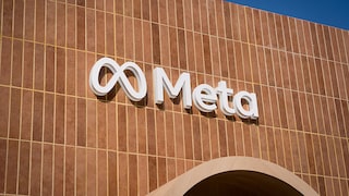 Brown wall with Meta lettering and logo in white