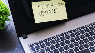 Sticky note on a laptop with the message "Time to Update."