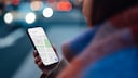 Woman holding a smartphone with a navigation app in her hand