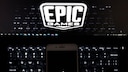 Laptop with Epic Logo and Apple Smartphone