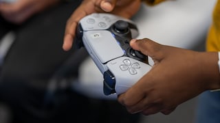 PlayStation controller in hand