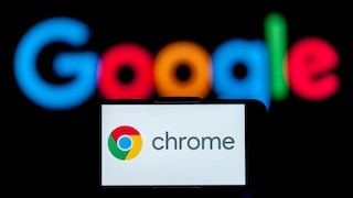 Smartphone with Chrome logo and Google lettering in the background