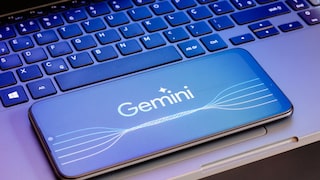 Smartphone with Gemini Logo on Laptop Keyboard