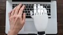 Robot Hand and Human Hand Typing on Computer