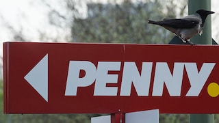 Penny logo on sign