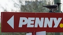 Penny logo on sign