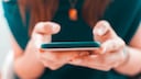 Fingers tapping on a smartphone