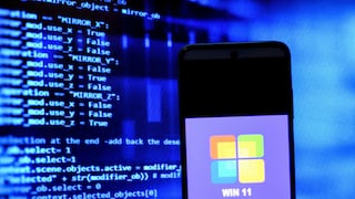Smartphone with Windows logo and codes in the background