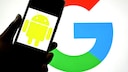 Smartphone with Android logo and Google logo in the background