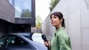 Woman Charging Her Electric Car