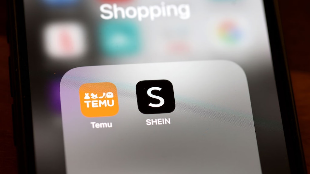 Smartphone with Temu and Shein Logo