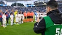 A man uses an iPhone during an MLS game in the U.S.
