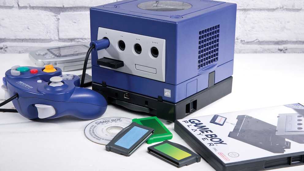 Nintendo GameCube with controller and a game on a table