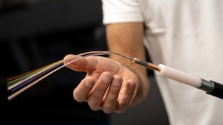 Technician with fiber-optic cable