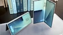 The Galaxy Z Fold 7 in front of a stack of books