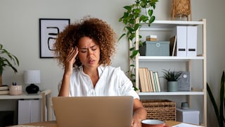 Woman with a Distorted Face in Front of Laptop