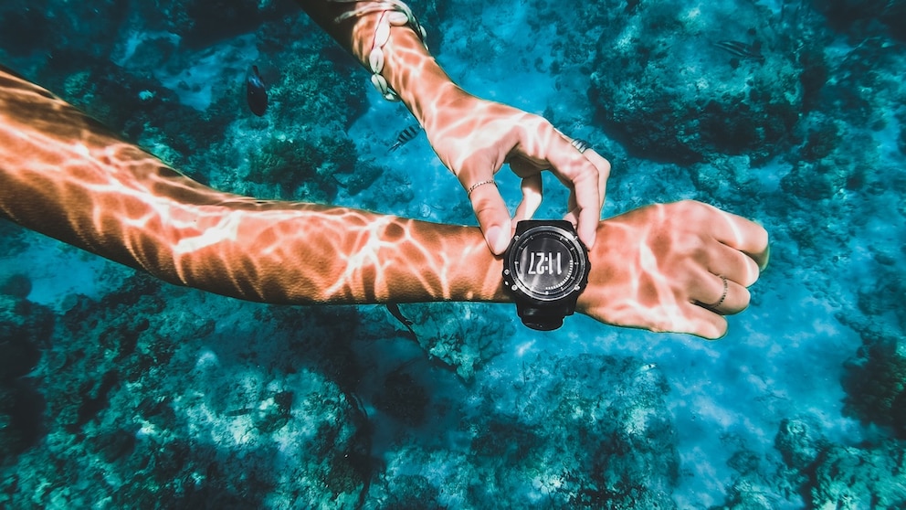 Person Uses a Smartwatch Underwater