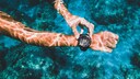 Person Uses a Smartwatch Underwater