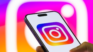 iPhone Displays Instagram Logo Against Instagram Logo Background