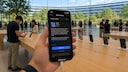 iPhone with iOS 27 update page at Apple headquarters (AI-generated)