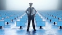 Police Officer Stands in a Room Full of Computer Monitors