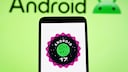 Smartphone with Android 17 logo.