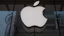 Apple logo on a window front.