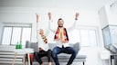 Germany fans celebrating on a couch.