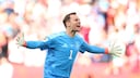 Manuel Neuer, wearing a blue jersey, runs jubilantly across a soccer field.