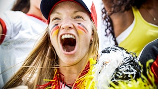 Female soccer fan with Germany merchandise.