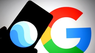 Smartphone with Google Earth logo in the foreground and Google logo in the background.