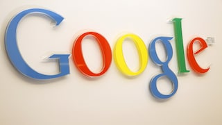 Google logo on a building wall.