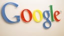Google logo on a building wall.