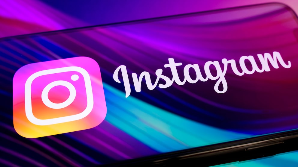 Smartphone with Instagram logo and lettering.