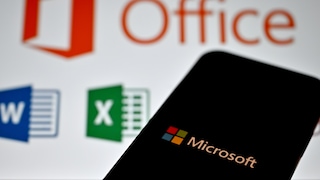 Smartphone with Microsoft logo in the foreground. In the background, the Microsoft Office logo.
