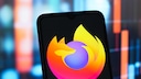 Smartphone with Mozilla Firefox logo.