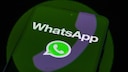 Smartphone with WhatsApp logo.