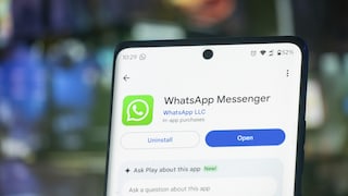 Smartphone with the Google Play Store entry for WhatsApp Messenger