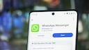Smartphone with the Google Play Store entry for WhatsApp Messenger