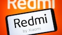Smartphone with Xiaomi Redmi logo.