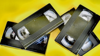 Several VHS tapes in a pile